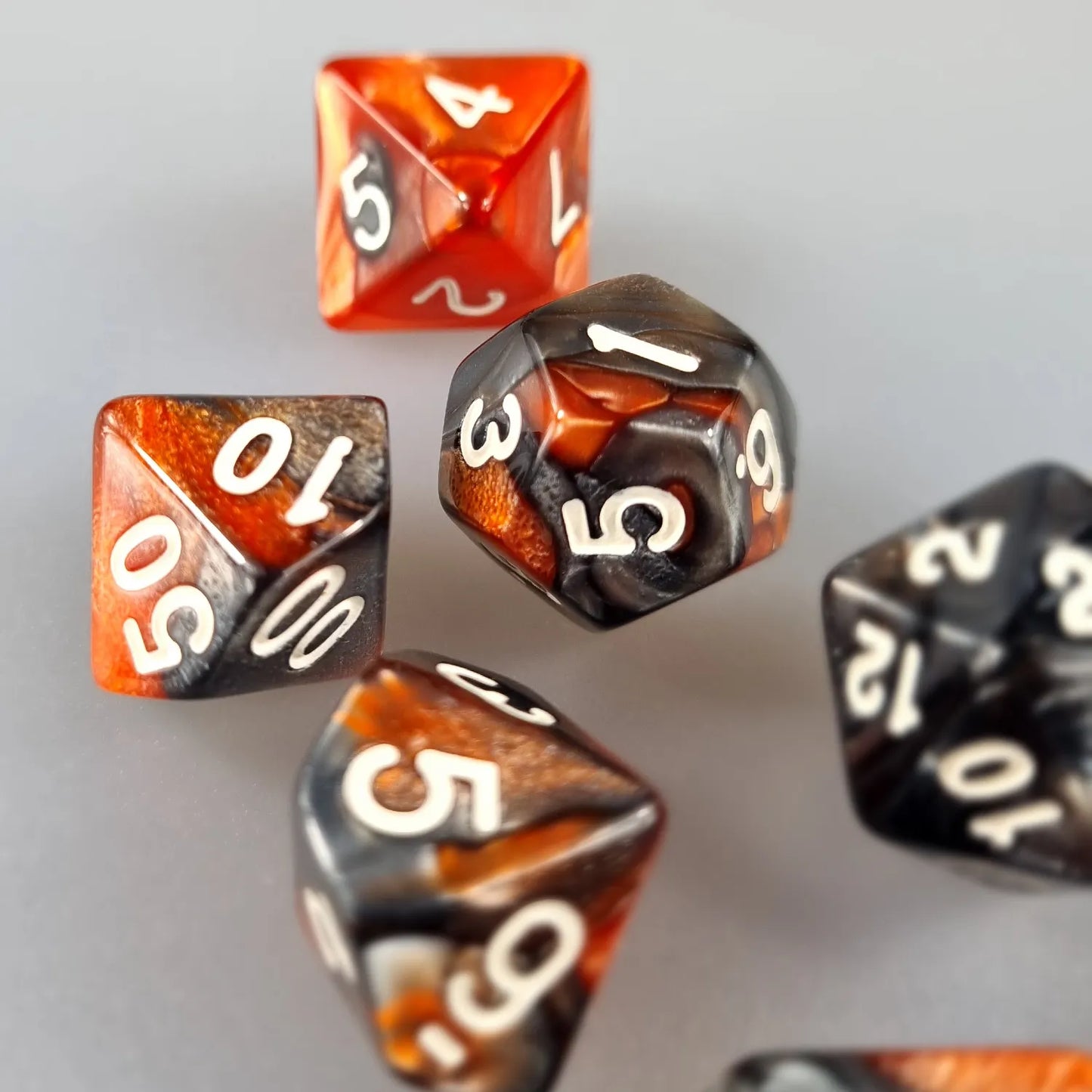 Orange & Black Dual Swirl Dungeons & Dragons Dice Set DiceBag.co.uk